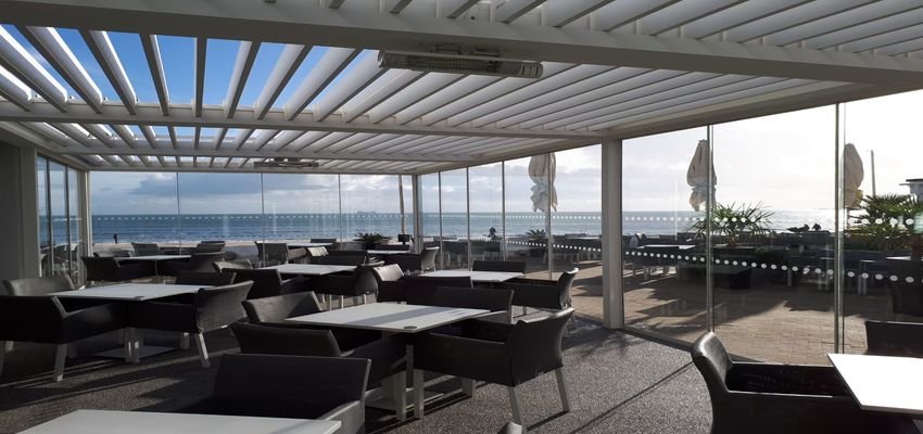 A outdoor commercial pergola at a beach restaurant
