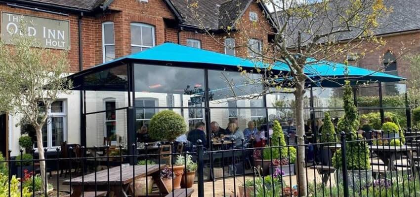 A covered outdoor seating area at a restaurant